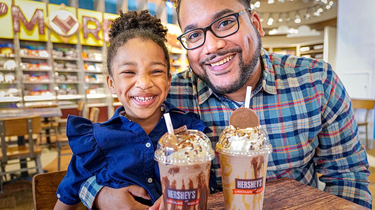 Father and Daughter Enjoying Milkshakes
